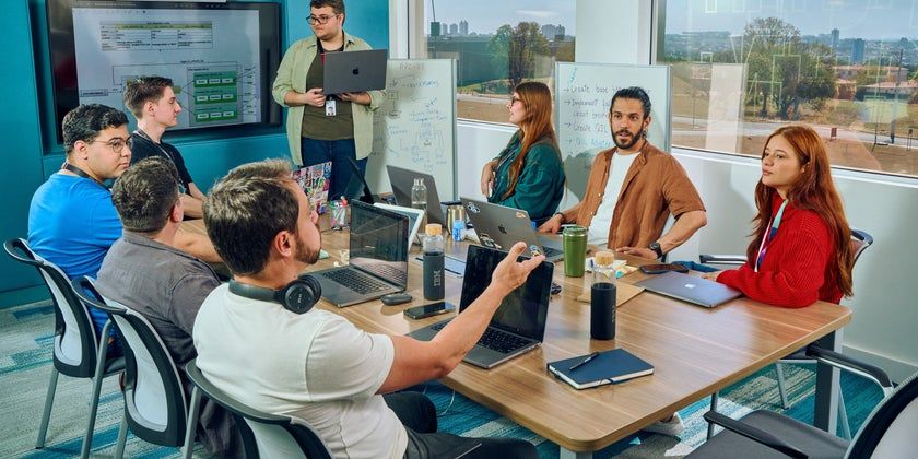 An enterprise team collaborating in a modern conference room.